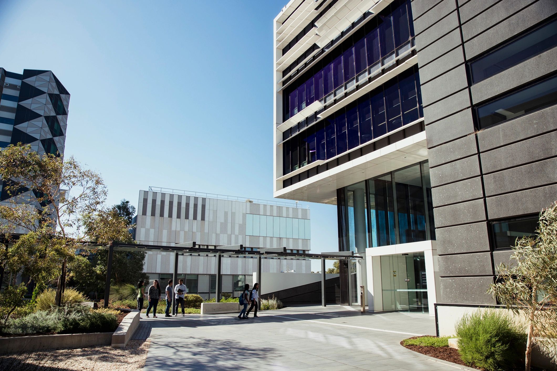 Students walking across a university campus