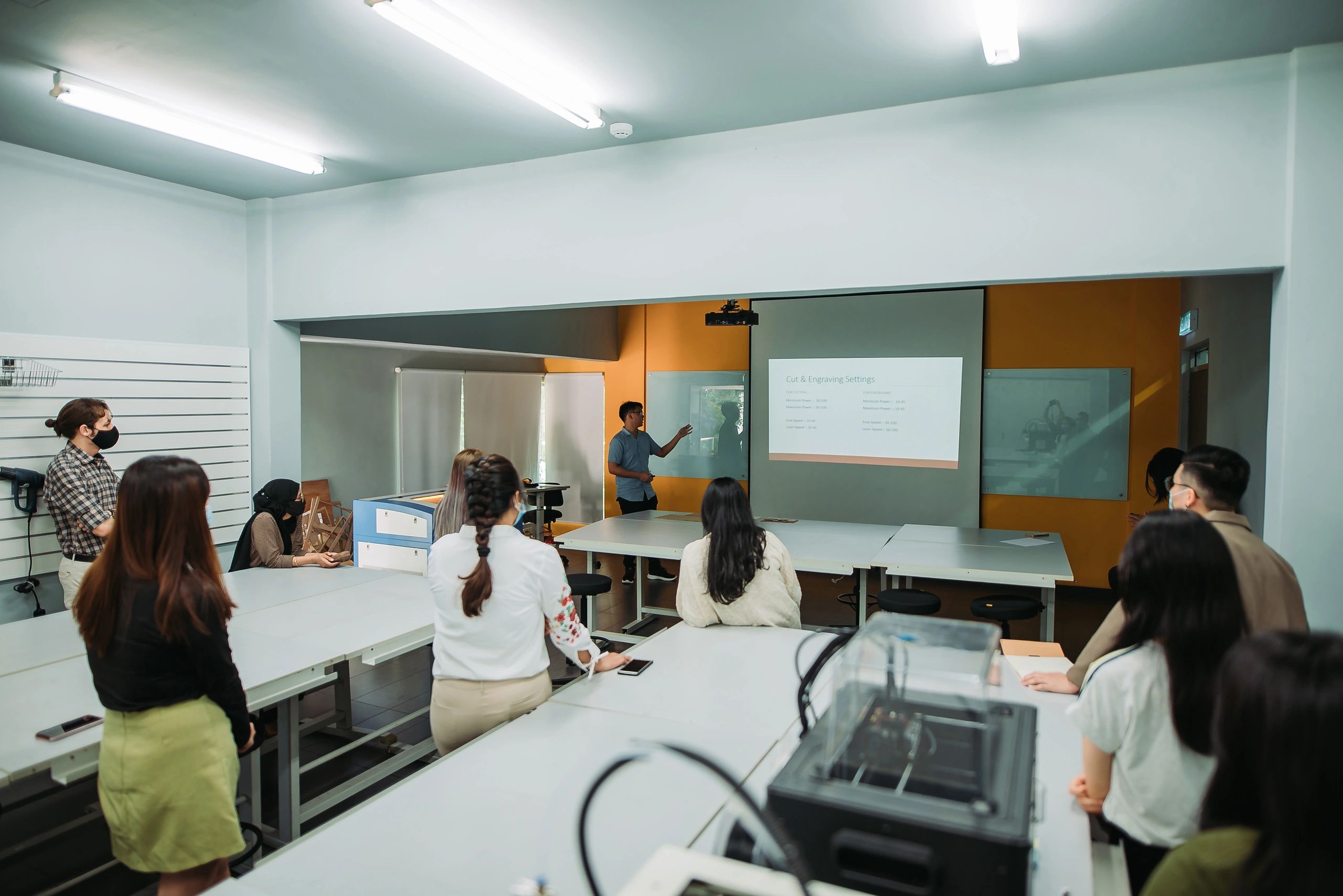Student presenting in a classroom training session
