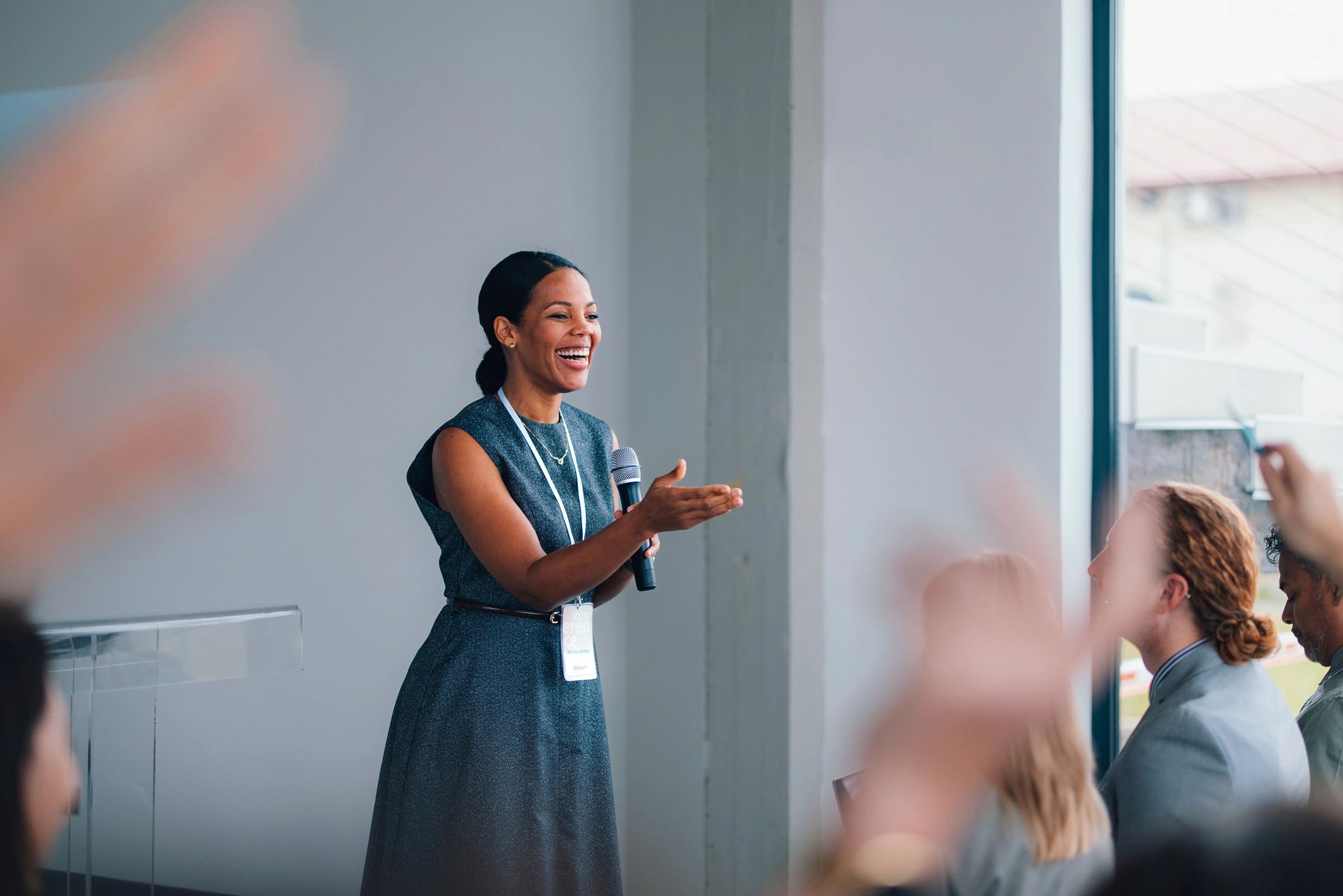 Education leader speaking to a group during a workshop